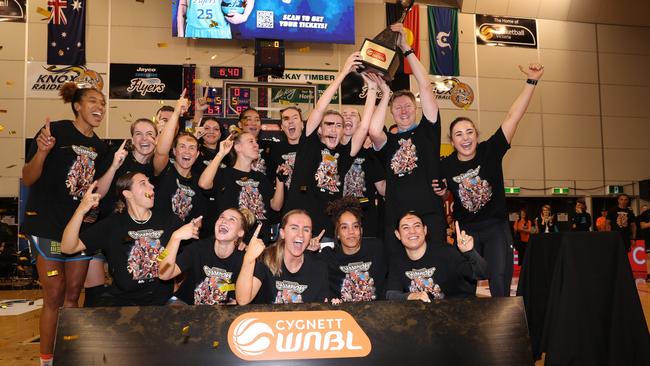 Townsville Fire celebrate and pose with the trophy after winning the WNBL Championship in 2023. (Photo by Kelly Defina/Getty Images)