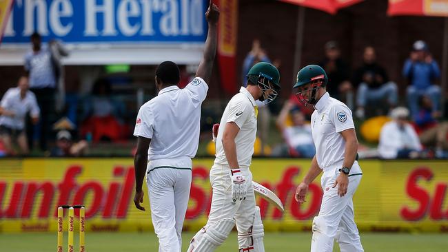 Kagiso Rabada picks up the wicket of Pat Cummins.