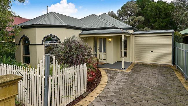 This three-bedroom house at 18 Tandana Court, Happy Valley, is on the market for $535,000 - $575,000.