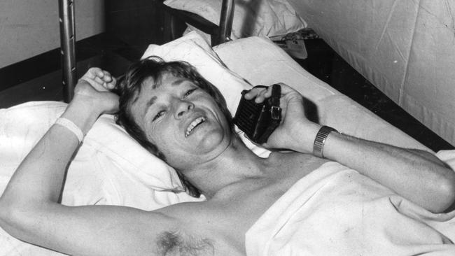 Recovering in the Royal Adelaide Hospital jockey John Letts listens to the races on his transistor radio, August 18, 1974.