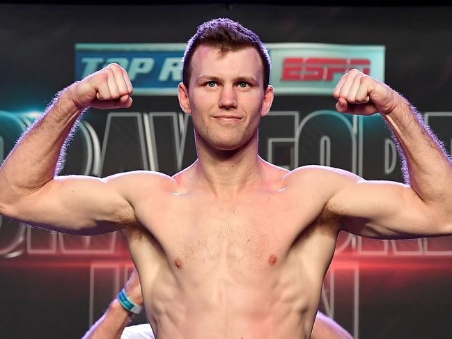 LAS VEGAS, NV - JUNE 08:  WBO welterweight champion Jeff Horn poses on the scale as he makes weight on his second attempt during his official weigh-in at MGM Grand Garden Arena on June 8, 2018 in Las Vegas, Nevada. Horn will defend his title against Terence Crawford on June 9 at MGM Grand in Las Vegas.  (Photo by Bradley Kanaris/Getty Images)