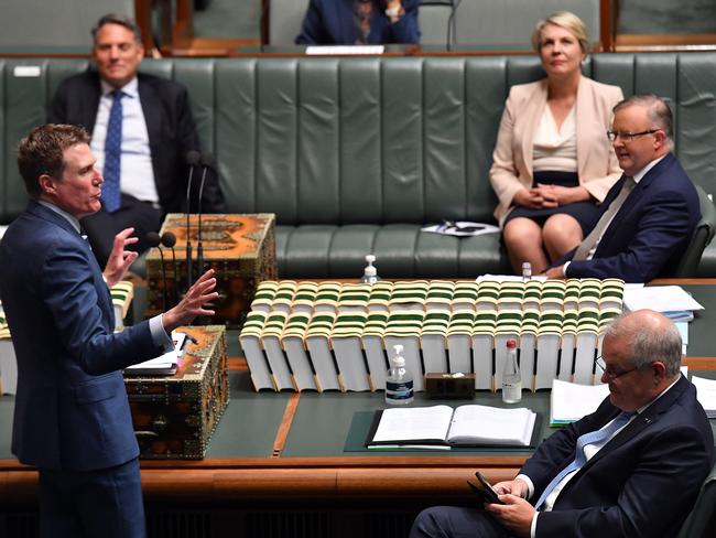 CANBERRA, AUSTRALIA - DECEMBER 10: Attorney-General Christian Porter speaks at the despatch box alongside the Prime Minister Scott Morrison (right) during Question Time in the House of Representatives at Parliament House on December 10, 2020 in Canberra, Australia. The Morrison government will seek to abolish the Ã¢â¬Åbetter off overall testÃ¢â¬Â for prospective enterprise agreements under its omnibus industrial relations package. (Photo by Sam Mooy/Getty Images)