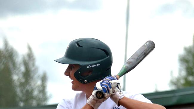 Mackay softballer Riley James playing for Australia at the Junior Mens Softball World Championship in Canada.