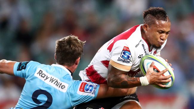 Elton Jantjies of the Lions is tackled at Allianz Stadium in Sydney.