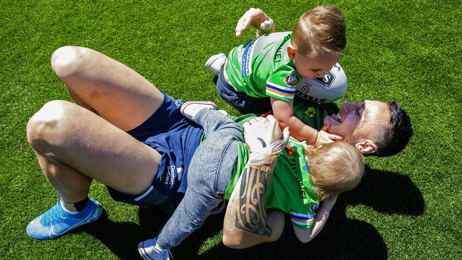 Nicoll-Klokstad plays with his children Rio and Kyrie after a Canberra Raiders training session. Picture: Jenny Evans/Getty Images