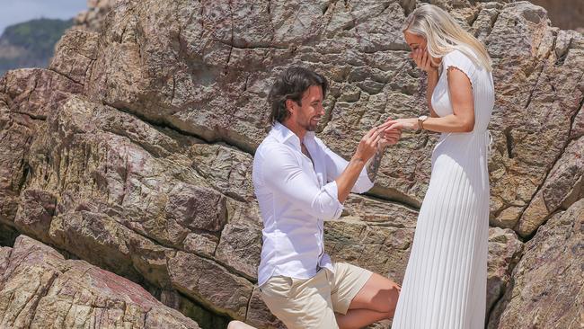 Michael Turnbull surprised Charlotte Cushing with a beach proposal following their pregnancy news. Michael said he asked Charlotte to start a family with him earlier this year with the couple admitting they felt “blessed” falling pregnant just months into trying. Picture: Glenn Campbell