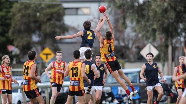 Jy Farrar (#2) shows off his athleticism in a division two match for Scotch OC against Morphettville Park earlier this year. Picture: AAP/Russell Millard