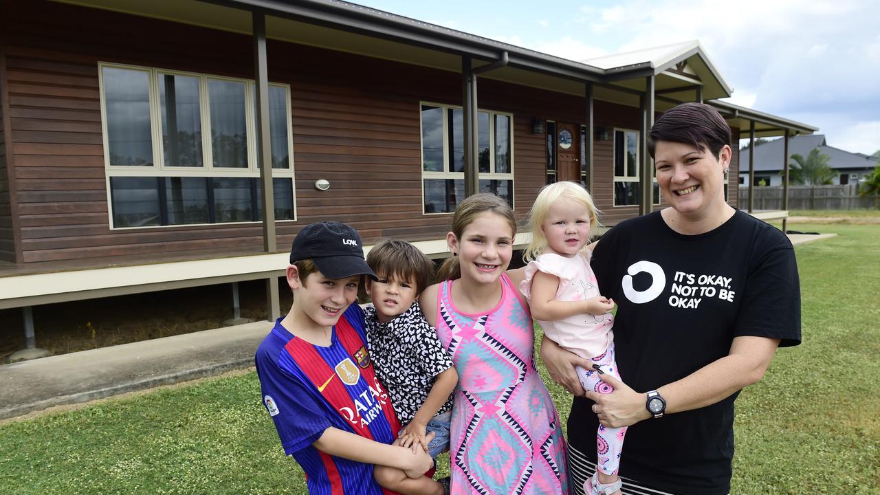 Trish Roberts with her children, Kai Leaney, 12, Zoe Leaney, 10, Emrys Roberts, 4, and Mabyn Roberts, 2, outside their new home in Alice River. Picture: Wesley Monts