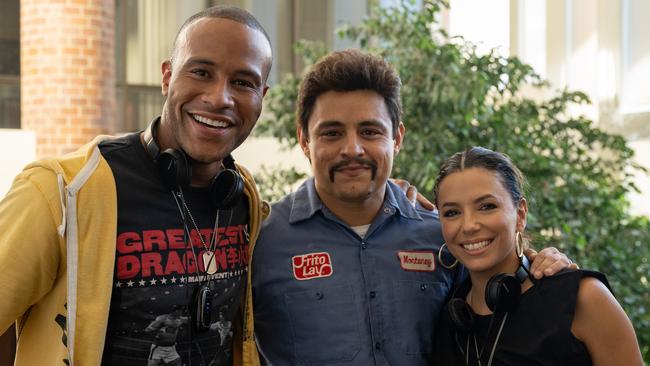 Producer DeVon Franklin and actor Jesse Garcia with Eva Longoria on the set of Flamin’ Hot. Picture: Anna Koori’s/Searchlight