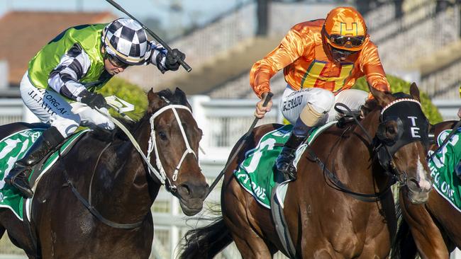 Tyzone (right) stormed home to win the Stradbroke at Eagle Farm. Picture: AAP