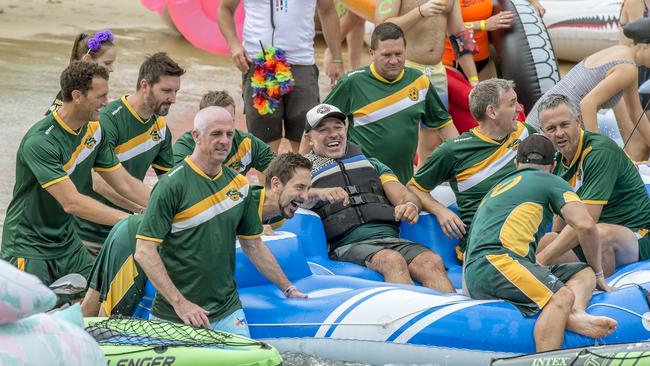 Former Wallaby Richard Tombs (middle) with his soccer teammates. (AAP IMAGE / Troy Snook)