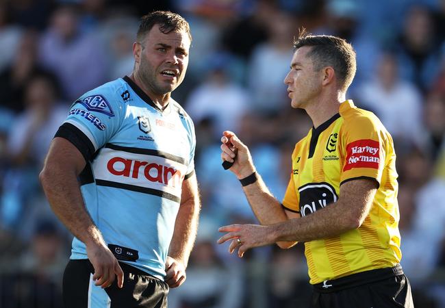 Wade Graham of the Sharks speaks to referee Chris Sutton (Photo by Mark Kolbe/Getty Images)