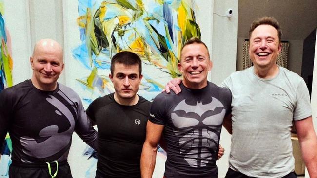 Elon Musk, right, at a training session with MMA fighter Georges St Pierre, second from right, at his gym. Picture: Twitter/GeorgesStPierre