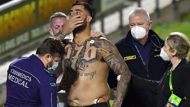 Andrew Fifita surrounded by medical staff. AAP Image, Darren England.