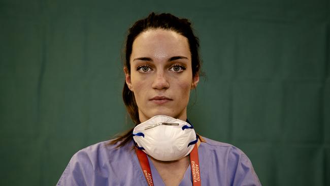 Martina Papponetti, 25, an ICU nurse in Italy poses for a portrait at the end of her shift on Friday, March 27, 2020. Picture: AP