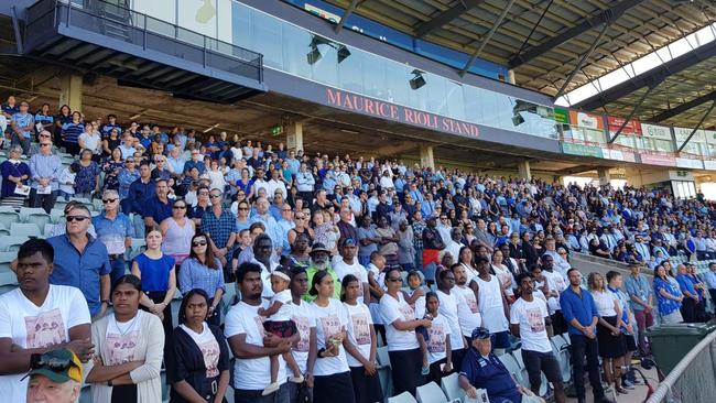 Hundreds of people gather in the stands of TIO Stadium to remember John Ah Kit at his state funeral. Picture: Che Chorley