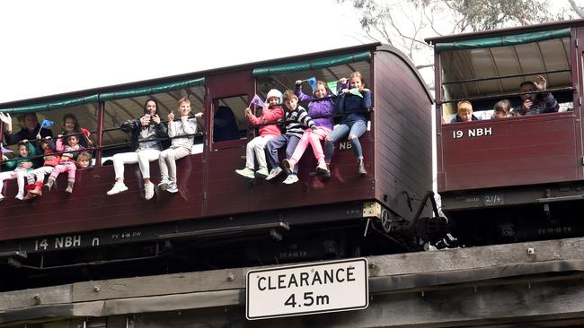 The operators of Puffing Billy are investigating a return to allowing passengers to have their legs out the window. Picture: Mike Keating.