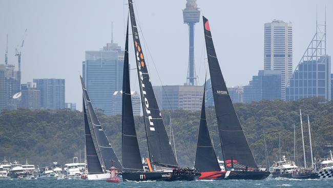 InfoTrack (second left) and Comanche locked in an early battle to start the Sydney to Hobart Yacht race. Picture: AAP