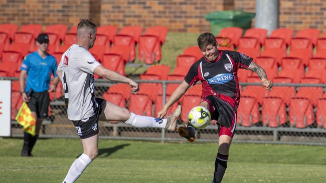 TIGHT FINAL: Willowburn’s Ben Barrowclift (left) and Stanthorpe’s Simon Mascadri battle for possession during the Toowoomba Football Leagues Premier Men’s grand final. Picture: Nev Madsen