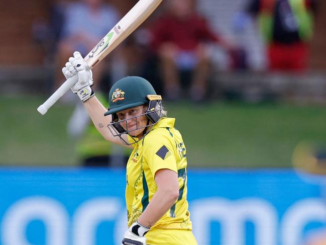 Australia's Alyssa Healy (L) celebrates after scoring a half-century (50 runs) during the Group A T20 women's World Cup cricket match between Sri Lanka and Australia at St George's Park in Gqeberha on February 16, 2023. (Photo by Marco Longari / AFP) / ALTERNATIVE CROP