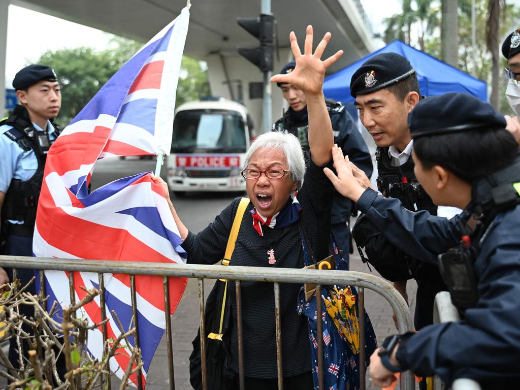 Pro-democracy protester “Granny Wong” shouts slogans outside a court in Hong Kong, after four men were convicted of rioting from the 2019 movement. Picture: Peter Parks/AFP