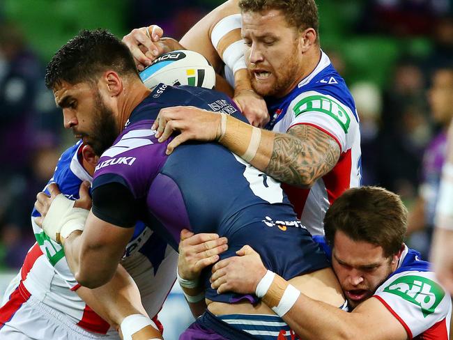 Jesse Bromwich tackled by the Knights defence. Picture: Colleen Petch.