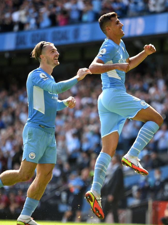 Manchester City stars Jack Grealish (left) and Rodrigo celebrate a goal against Arsenal. Picture: AFP