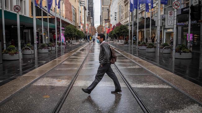 A near-empty Bourke Street in Melbourne on Thursday. Picture: Jake Nowakowski