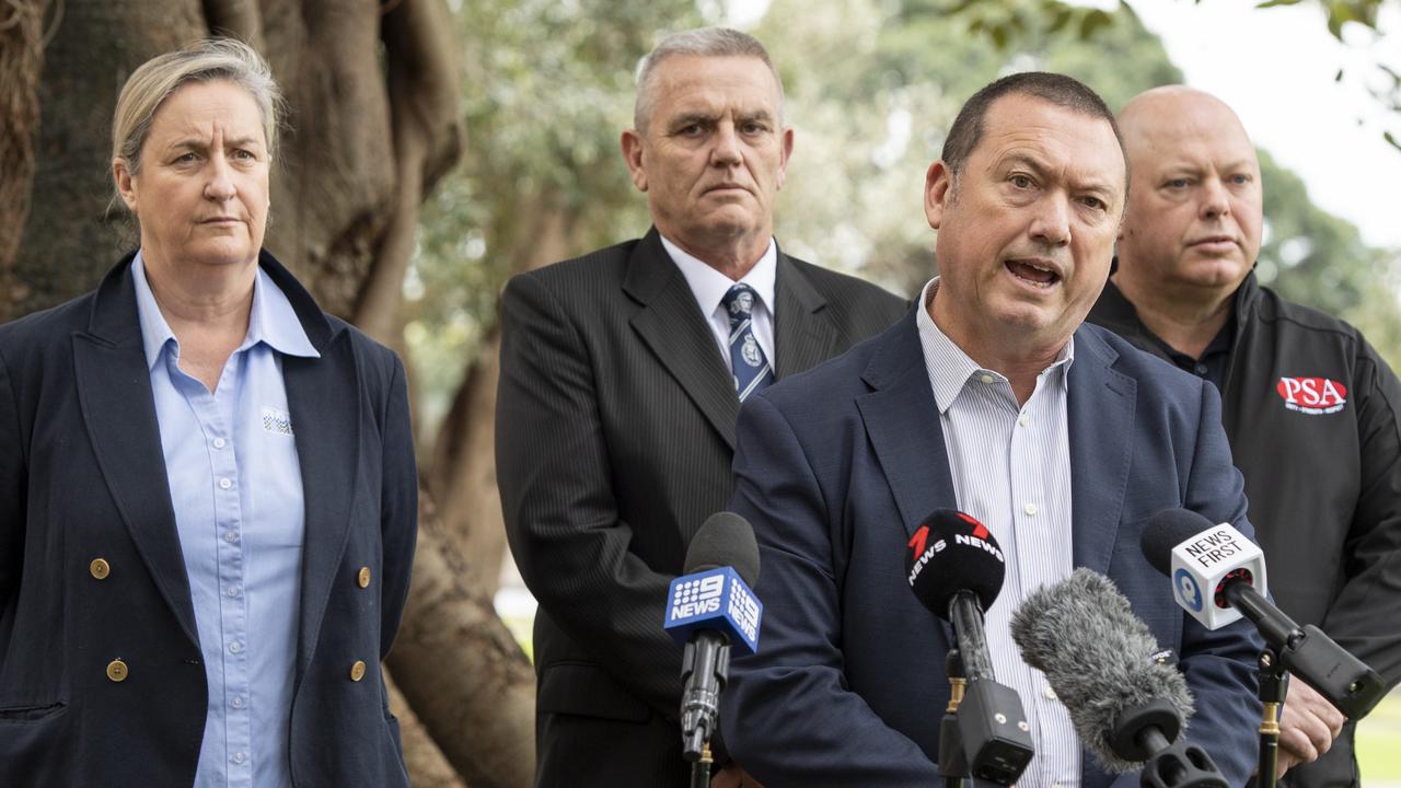 Stewart Little, third from left, said officers would strike. Picture: NewsWire / Monique Harmer