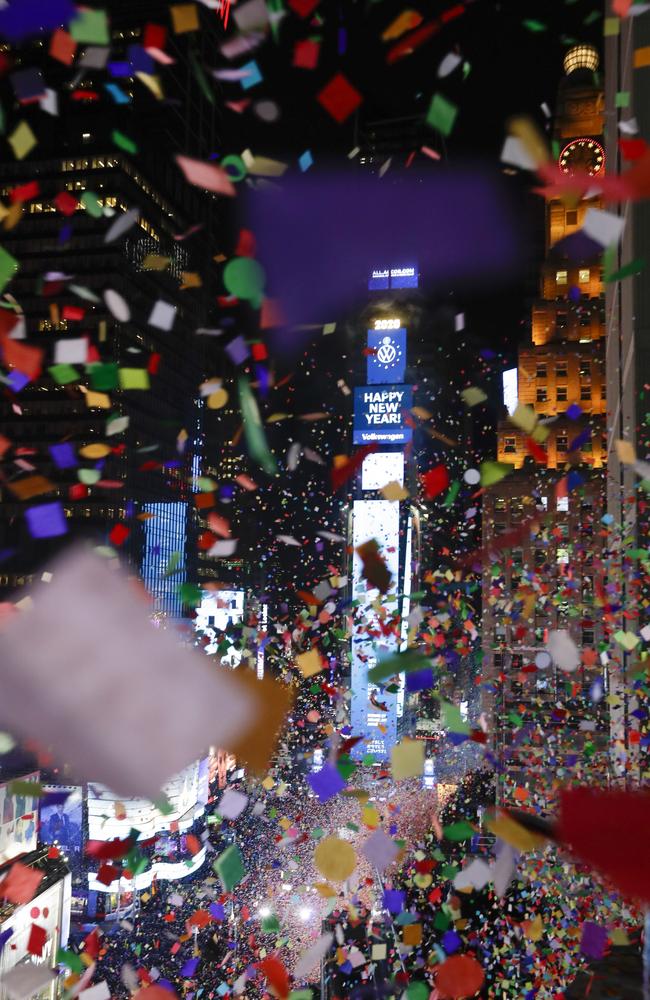 Confetti drops over the crowd as the clock strikes midnight during the New Year's celebration as seen from the New York Marriott Marquis in New York's Times Square. Picture: AP