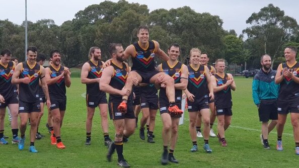 Old Yarra Cobras half back James Fleming being chaired off after his 100th game on Saturday. Picture: Supplied.