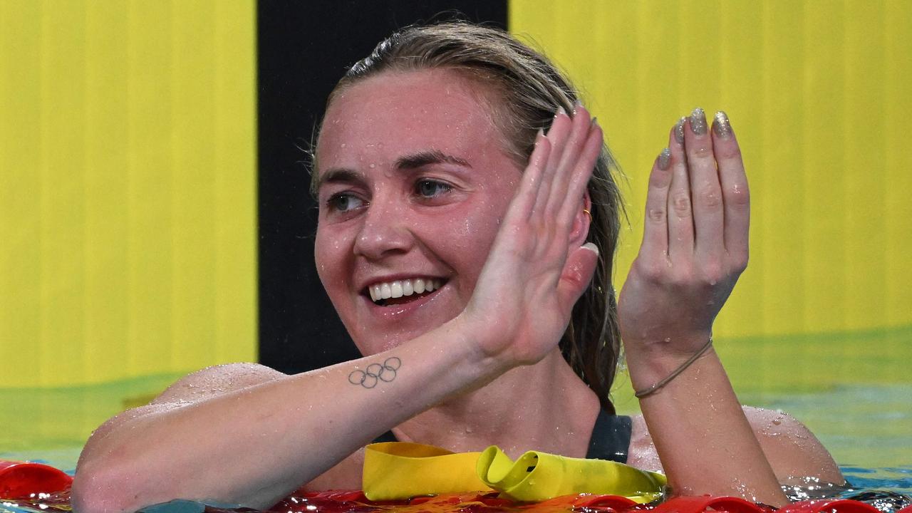 Australia's Ariarne Titmus celebrates winning and taking the gold medal in the women's 800m.