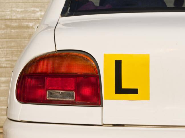 Image Of A Yellow L-Plate On White Car , Indicative Of A Learner Driver. Picture: iStock