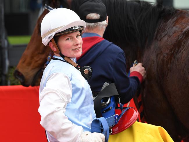 Jockey Kate Walters reacts in the mounting yard after riding Brigadier to victory in race 4, the Banta App Handicap during the Wednesday Races at Moonee Valley Racecourse in Melbourne, Wednesday, June 27, 2018. (AAP Image/James Ross) NO ARCHIVING, EDITORIAL USE ONLY