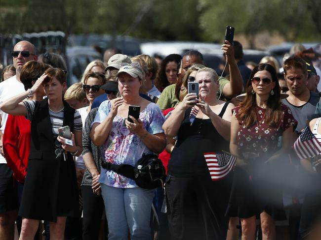 A large crowd gathered to watch the casket of the late John McCain arrive for a memorial service at North Phoenix Baptist Church. Picture: AP