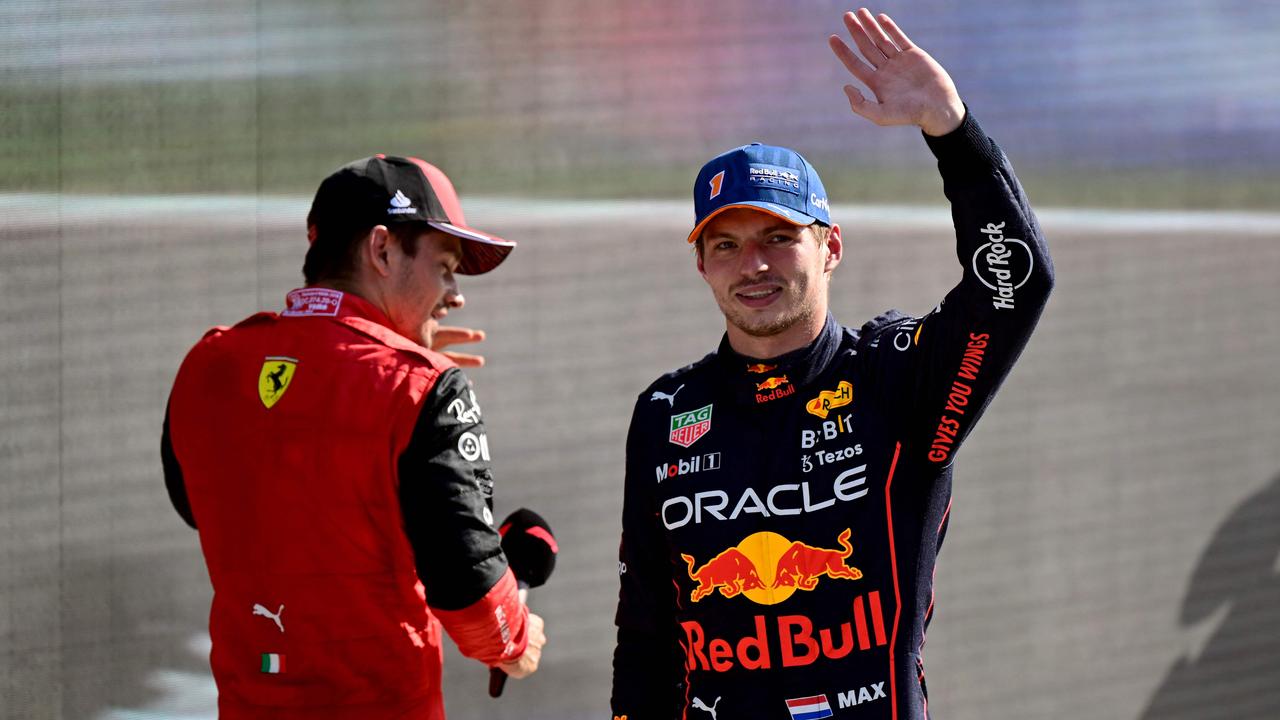 Red Bull Racing's Dutch driver Max Verstappen (R) salutes the crowd