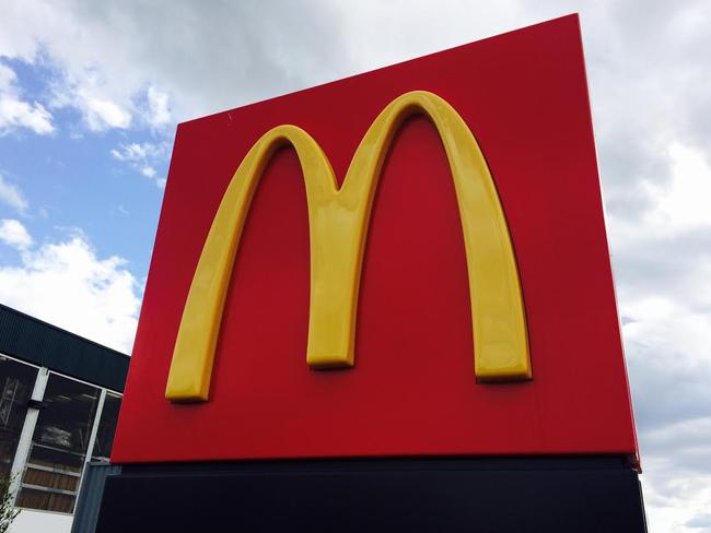 Generic McDonald's sign (the golden arches) with clouds in the background at Marsden Park. Fast food giants/unhealthy food/takeaway food. Generic Marsden Park photos.