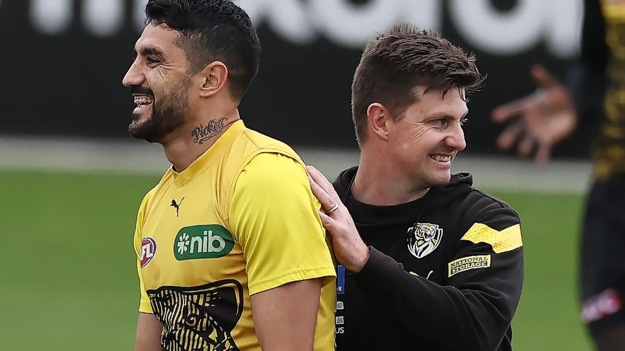 Pickett gets a pat on the back from Richmond caretaker coach Andrew McQualter. Picture: Michael Klein