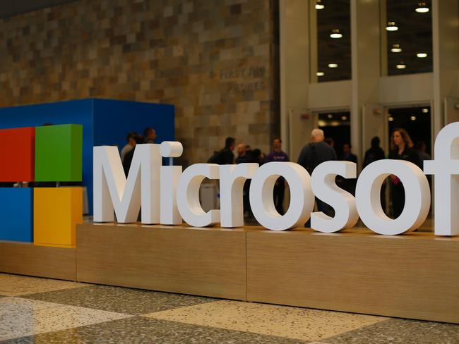 (FILES) This file photo taken on April 28, 2015 shows a Microsoft logo during the 2015 Microsoft Build Conferenceat Moscone Center in San Francisco, California. Microsoft on August 22, 2016 announced it bought a startup to boost its artificial intelligence capabilities, and rival Apple confirmed it has boosted its health focus with an acquisition of its own. Microsoft did not disclose financial terms of its deal to buy Genee, which specializes in using machine smarts to handle the time-sucking task of scheduling meetings. / AFP PHOTO / GETTY IMAGES NORTH AMERICA / Stephen Lam