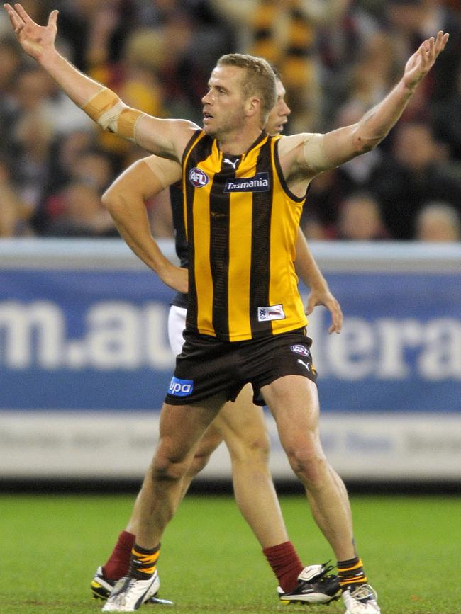 Rick Ladson celebrates a goal for Hawthorn.