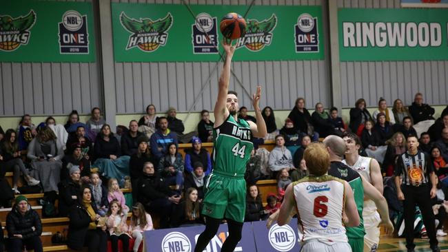 Ringwood’s Joey Miller nails a pretty floating lay up against North-West Tasmania on Saturday night. Picture: Kath Miles