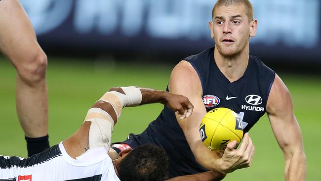 Carlton's Liam Jones battles with Collingwood's Travis Varcoe. Pic: Michael Klein