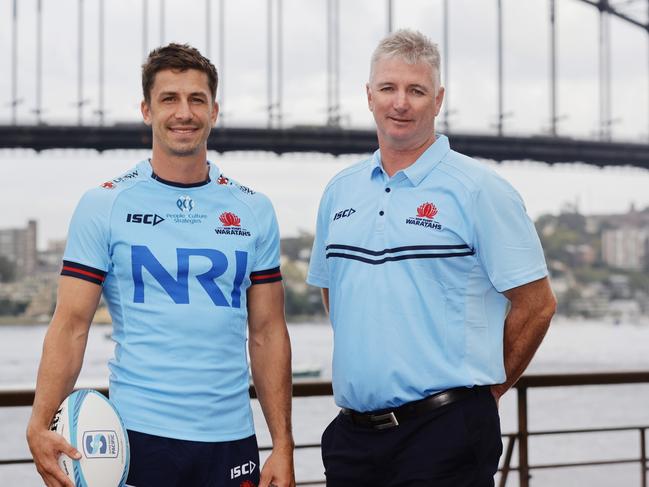 SYDNEY, AUSTRALIA - FEBRUARY 15: Jake Gordon of the NSW Waratahs and head coach Darren Coleman of the NSW Waratahs pose during the 2023 Super Rugby Pacific Season Launch at Sydney Opera House on February 15, 2023 in Sydney, Australia. (Photo by Jenny Evans/Getty Images)