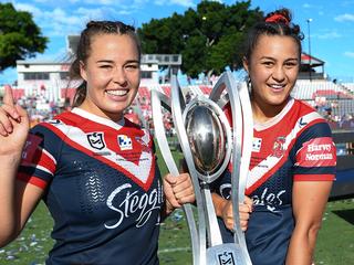 BRISBANE, AUSTRALIA - APRIL 10: Isabelle Kelly and Roosters captain Corban Baxter pose with the Premiership trophy during the NRLW Grand Final match between the St George Illawarra Dragons and the Sydney Roosters at Moreton Daily Stadium, on April 10, 2022, in Brisbane, Australia. (Photo by Albert Perez/Getty Images)