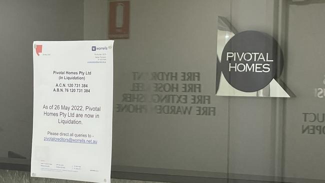 A notice out the front of a Pivotal Homes office informing the public they have gone into liquidation.