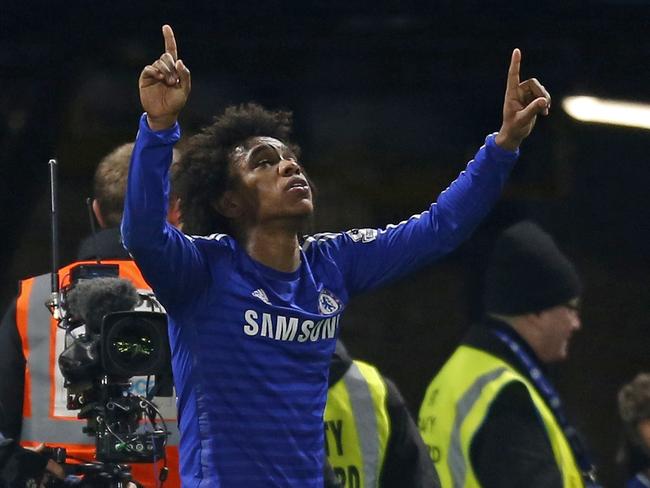 Chelsea’s Brazilian midfielder Willian celebrates after scoring the only goal of the English Premier League football match between Chelsea and Everton at Stamford Bridge in London on February 11, 2015. Chelsea won the game 1-0. AFP PHOTO / IAN KINGTON RESTRICTED TO EDITORIAL USE. NO USE WITH UNAUTHORIZED AUDIO, VIDEO, DATA, FIXTURE LISTS, CLUB/LEAGUE LOGOS OR "LIVE" SERVICES. ONLINE IN-MATCH USE LIMITED TO 45 IMAGES, NO VIDEO EMULATION. NO USE IN BETTING, GAMES OR SINGLE CLUB/LEAGUE/PLAYER PUBLICATIONS.