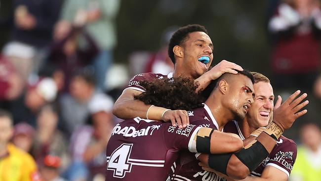 MUDGEE, AUSTRALIA – APRIL 02: Haumole Olakau'atu of the Sea Eagles celebrates with his teammates Jason Saab, Daly Cherry-Evans and Morgan Harper of the Sea Eagles after scoring a try during the round four NRL match between the Manly Sea Eagles and the Canberra Raiders at Glen Willow Sporting Complex, on April 02, 2022, in Mudgee, Australia. (Photo by Mark Kolbe/Getty Images)