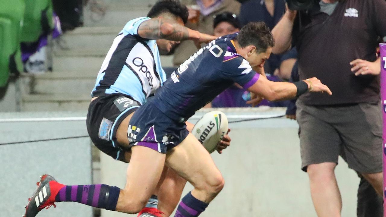 Billy Slater collides with Sosaia Feki.