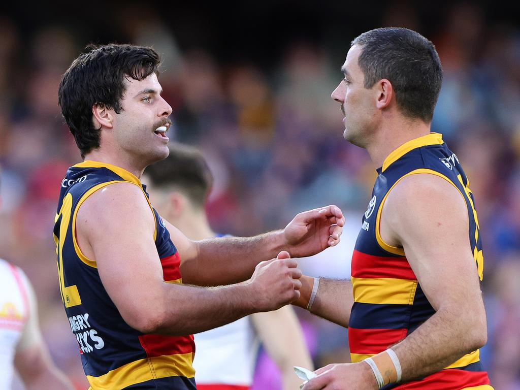 Darcy Fogarty (L) showed out in game 100. Picture: Sarah Reed/AFL Photos via Getty Images