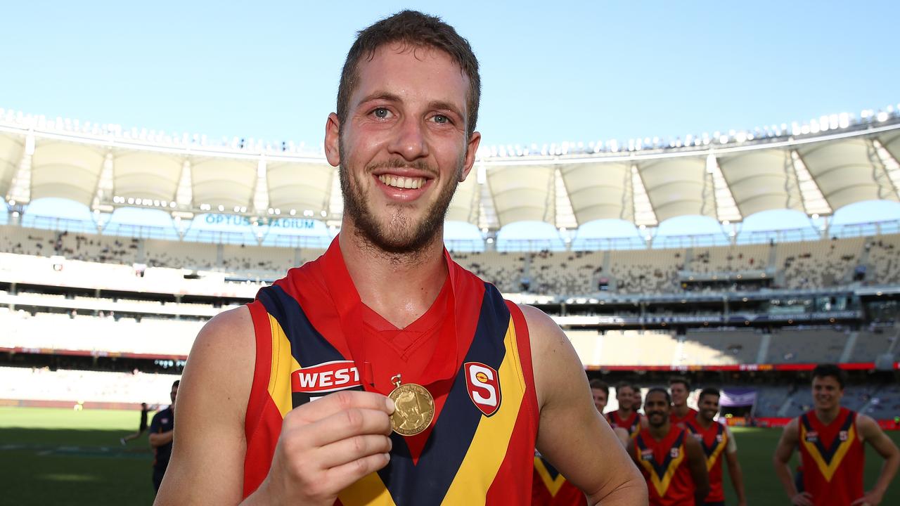 PERTH, AUSTRALIA - MAY 12: Michael Knoll of the SANFL poses with the Foss-Williams medal for best SANFL player during the state game between WA and SA at Optus Stadium on May 12, 2019 in Perth, Australia. (Photo by Paul Kane/Getty Images)